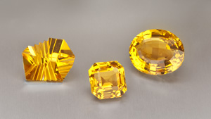 A jeweler’s display shows off citrine’s glowing shades with a  designer-cut beauty alongside more traditional emerald-cut and oval gems.