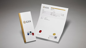 GIA Colored Stone Identification Report with main components of the report on display, and colored stones and pearls on the front cover.