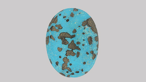 Turquoise bead with artificial metallic pyrite.