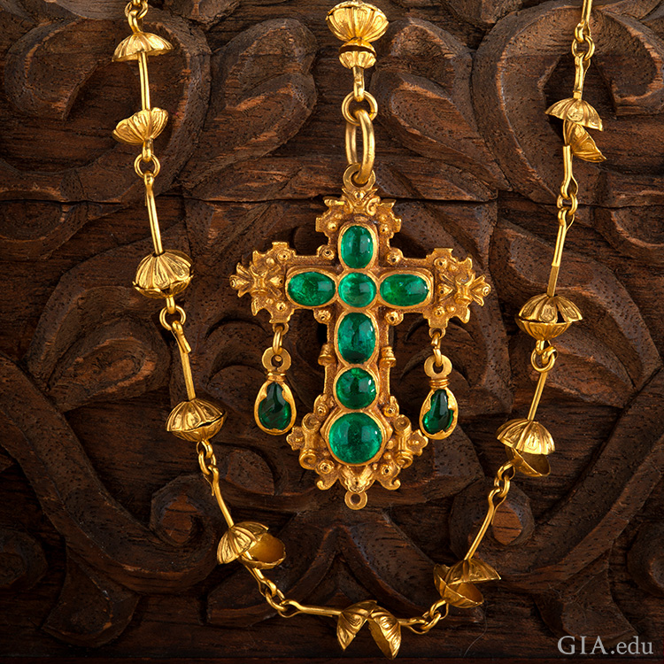 The May birthstone is the focal point of a gold rosary necklace with a cross made of seven emeralds, recovered from the Nuestra Señora de Atocha shipwreck.