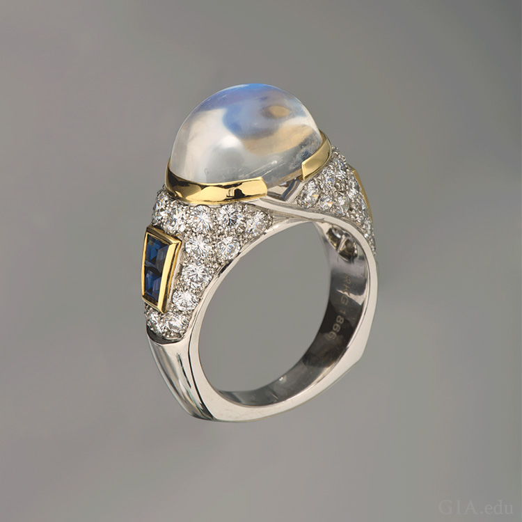 A platinum ring boasts the June birthstone, an 8.34 carat moonstone set with sapphires.