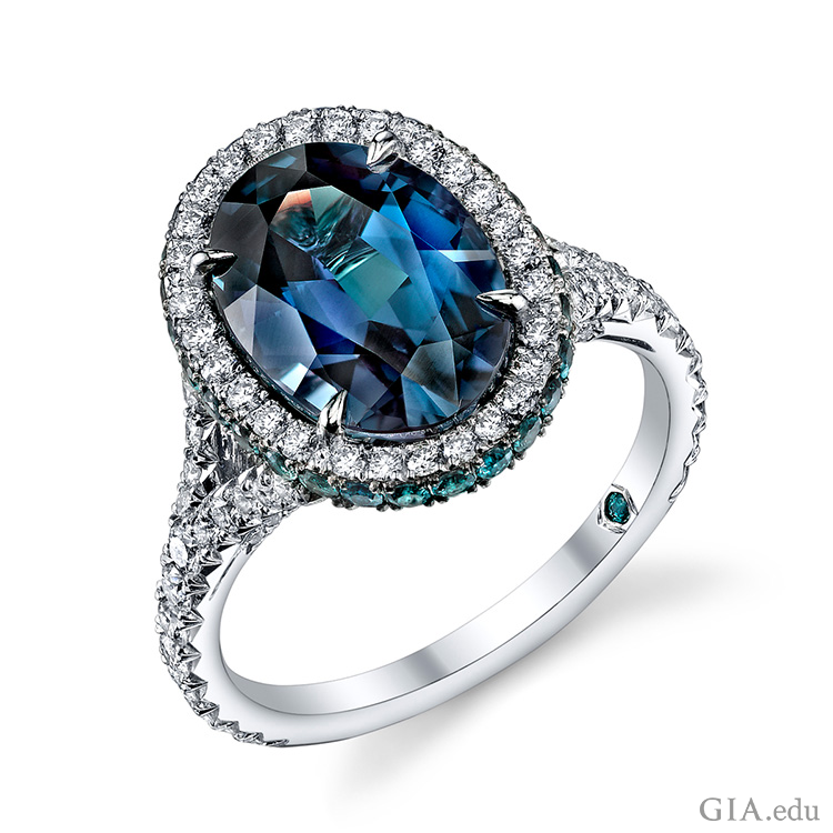 The June birthstone is prominent in a 5.16 carat oval alexandrite ring surrounded by brilliant round diamonds and alexandrites set in platinum.