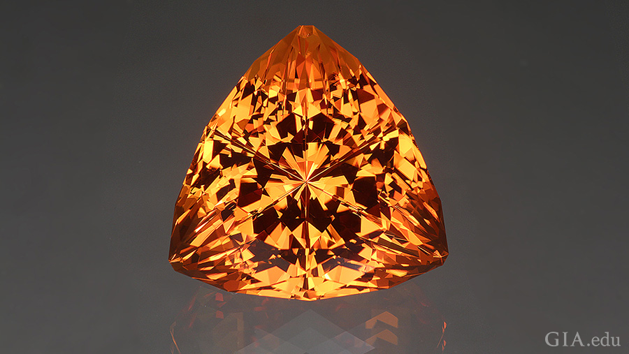 The November birthstone is shown off with a fantasy cut that unleashes the fire within this 43.49 carat orange citrine.