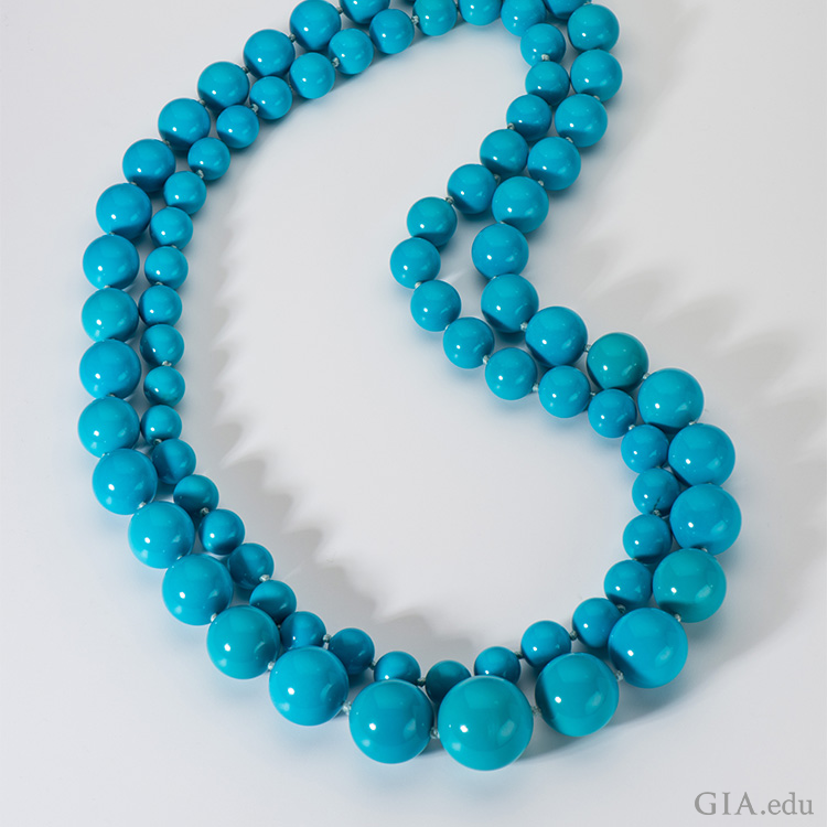 A double-strand necklace with intense turquoise beads flaunts the December birthstone from Arizona’s Sleeping Beauty mine. 
