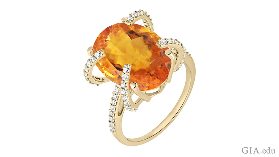 The November birthstone is shown off in this orange oval cut citrine ring with diamonds.