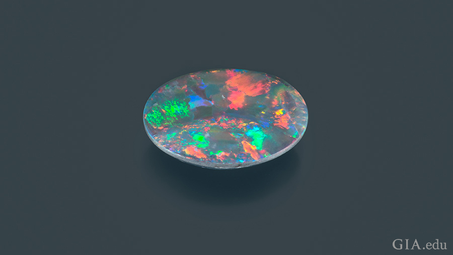 Specks of pink, green, blue, and orange are found on the colorful 1.72 carat October birthstone, opal.