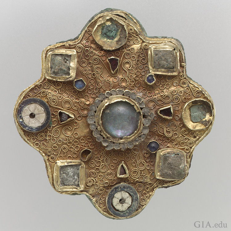 The June birthstone is featured in a Frankish disk brooch from the second half 7th century made of gold sheet, filigree, moonstone, glass cabochons, garnets, mother-of-pearl, and moonstone.