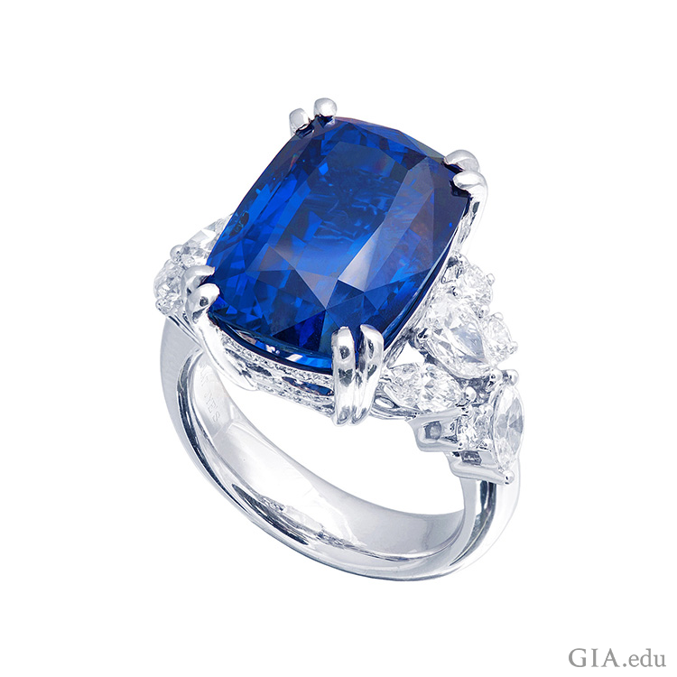 A rich blue sapphire set in a ring with diamonds shows off the September birthstone.