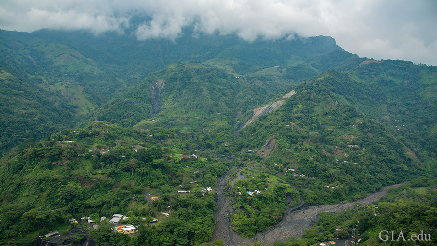 The May birthstone, emerald, is found in the landscape of the lush green Andes Mountains towering over the deep tropical valleys around Muzo.