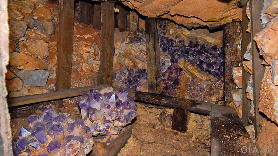 Large amethyst and ametrine crystals line the walls of Bolivia’s historic Anahí mine, showcasing the February birthstone.